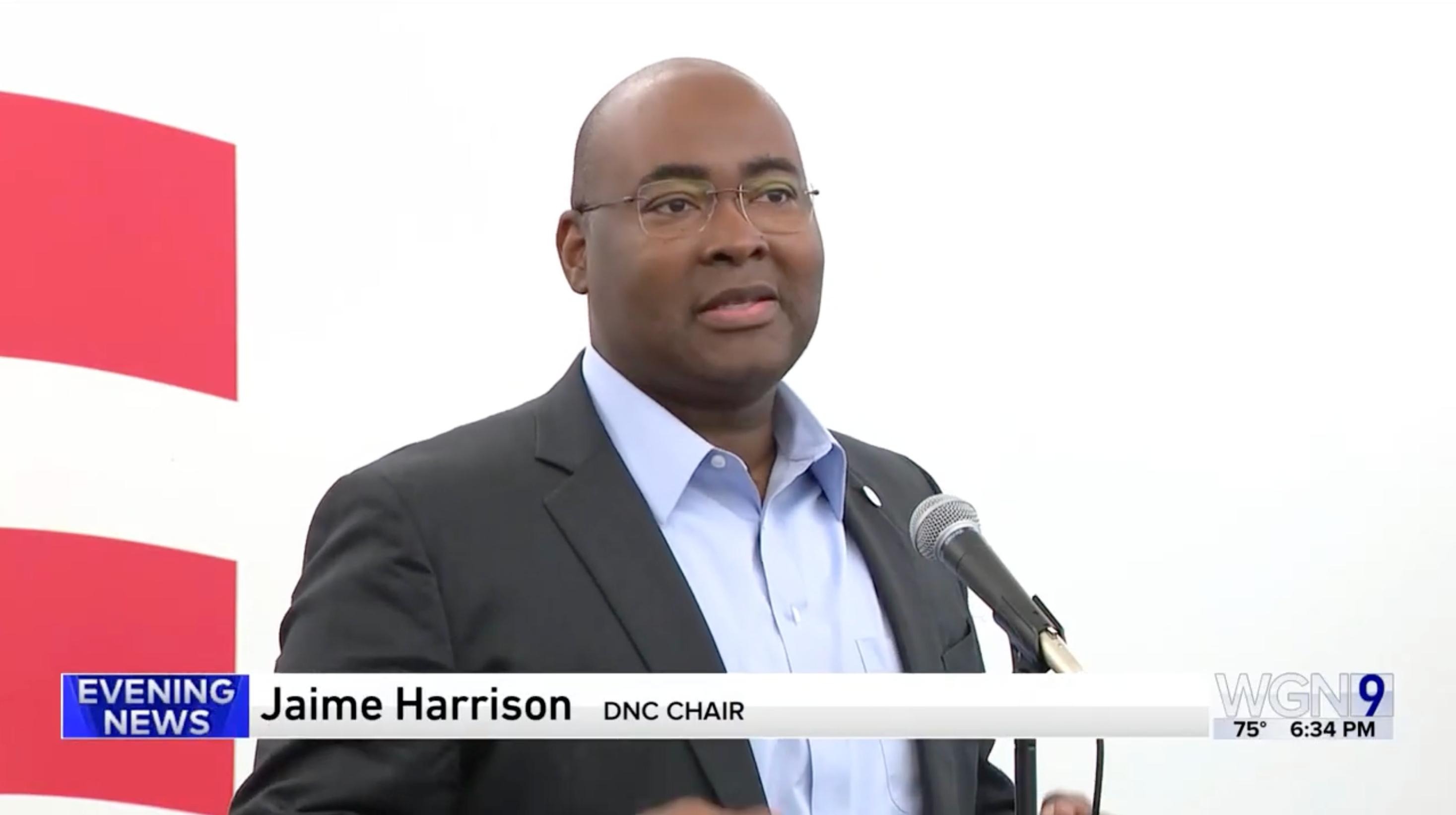 Screenshot from WGN's clip of Chair Jaime Harrison speaking to crowd